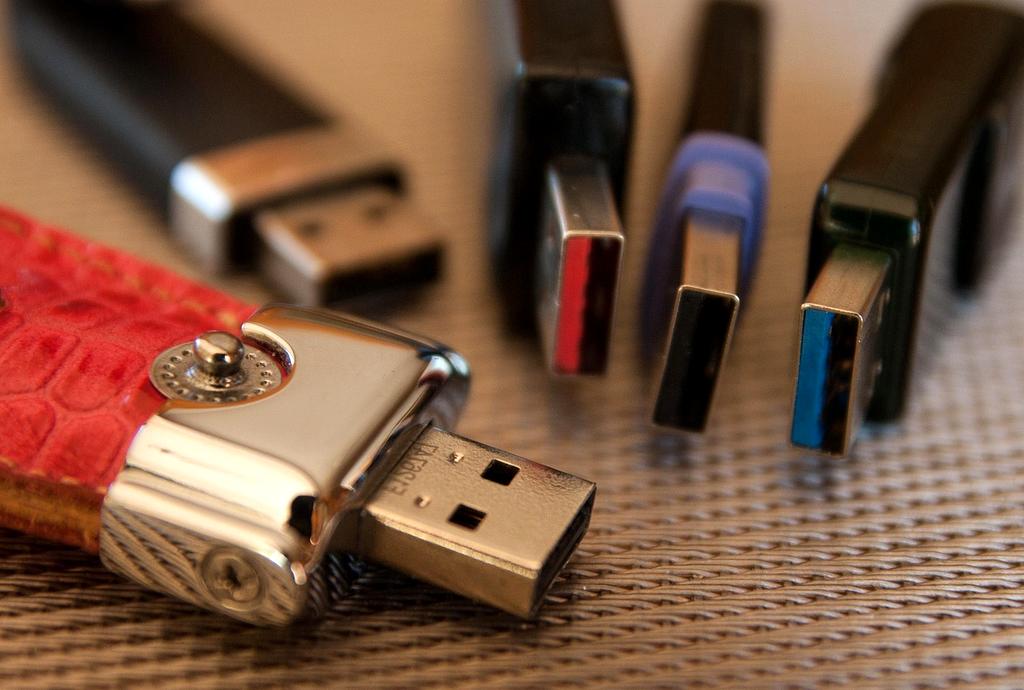 Stack of modern computer memory modules and storage devices on a tech-themed background