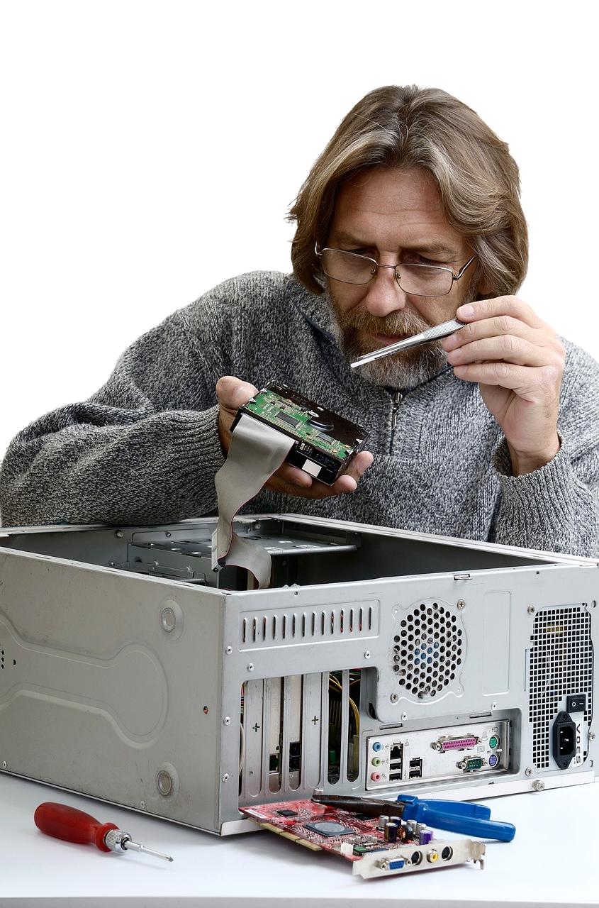 Technician optimizing computer memory modules and storage devices
